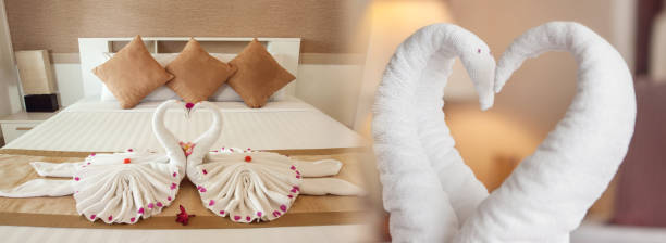 istock Towel swans shaped on the bed, Honeymoon bed 1412566499