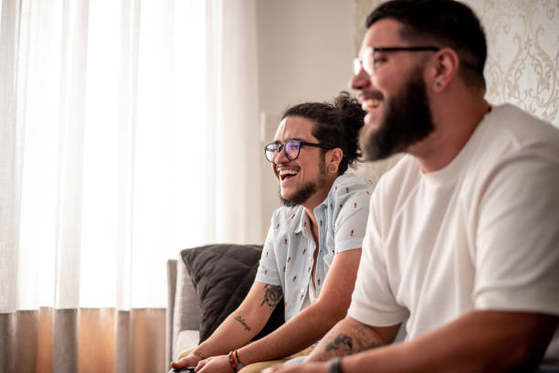 istock Two friends playing video games 1412567961