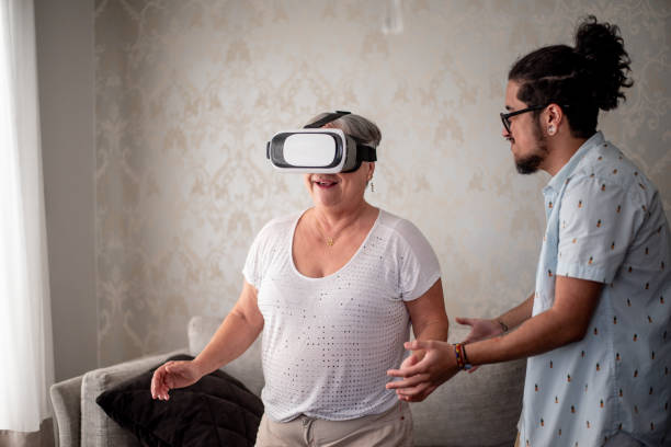 istock Mother and transgender son playing with virtual reality glasses 1412568021