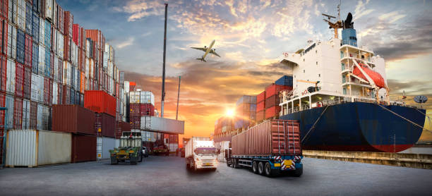istock Logistics and transportation of Container Cargo ship and Cargo plane with working crane bridge in shipyard at sunrise, logistic import export and transport industry background 1412568952