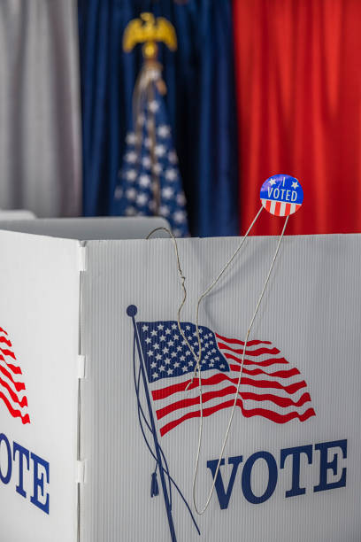 istock An opened metal coat hanger with I vote today sticker 1412572197