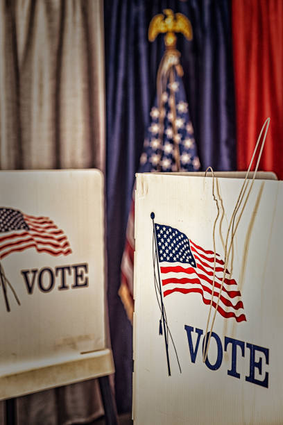 istock An opened metal coat hanger hanging from voting booth 1412572314