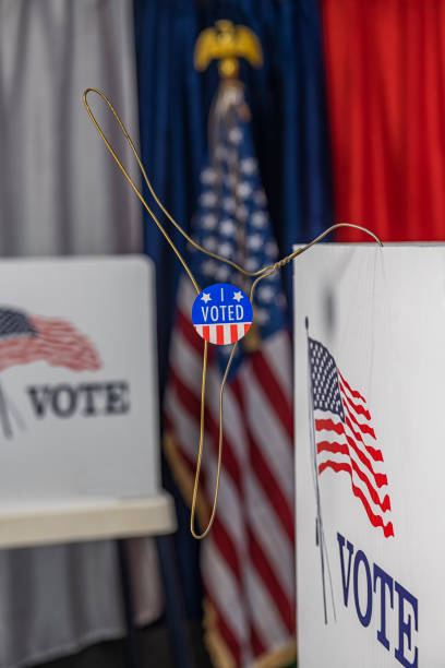 istock An opened metal coat hanger with I vote today sticker 1412572372