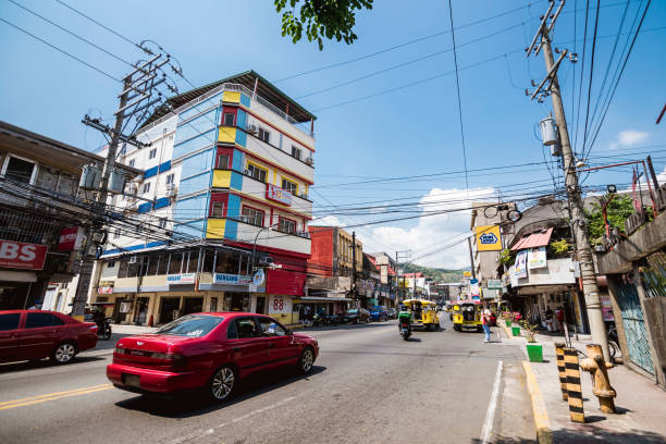 Olongapo, Zambales, Philippines - A typical street view of commercial buildings along Rizal Avenue. Olongapo, Zambales, Philippines - April 2022: A typical street view of commercial buildings along Rizal Avenue. zambales province photos stock pictures, royalty-free photos & images