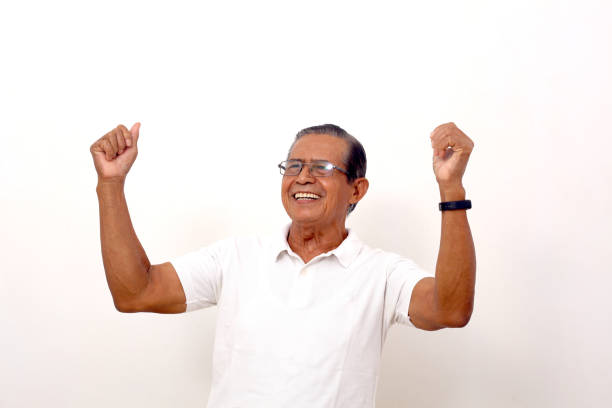 istock Wow and excited expression of asian man while standing with winning gesture. Isolated on white 1412573505