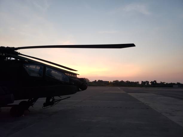 istock Boeing Attack Helicopter A.K.A AH 64E Apache enjoy the sunset 1412577489