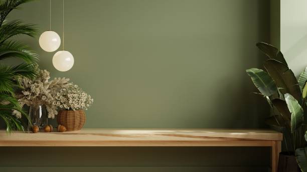 Green wall panelling with wooden shelf in kitchen room.