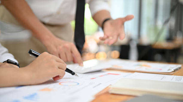istock A team of financial assistant working together. cropped image 1412578575