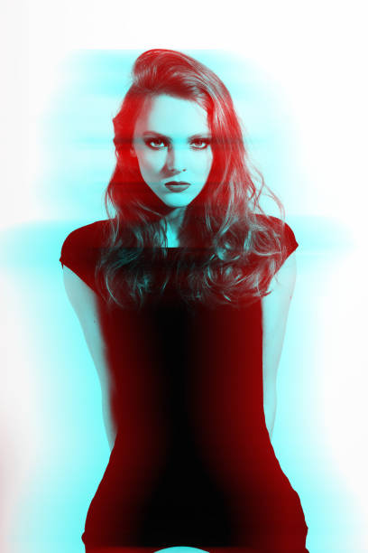 istock Beautiful woman studio portrait in RGB color effect split 1412578767