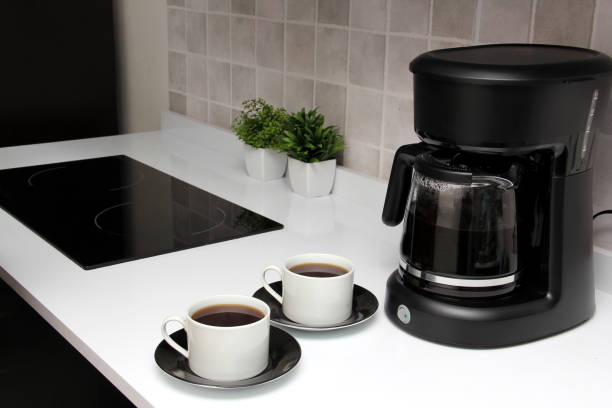 istock Freshly prepared coffee in a filter coffee machine served in white cups that is rich in antioxidants, fights Alzheimer's and Parkinson's, produces tachycardia and insomnia 1412579408