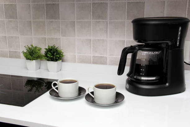 istock Freshly prepared coffee in a filter coffee machine served in white cups that is rich in antioxidants, fights Alzheimer's and Parkinson's, produces tachycardia and insomnia 1412579456