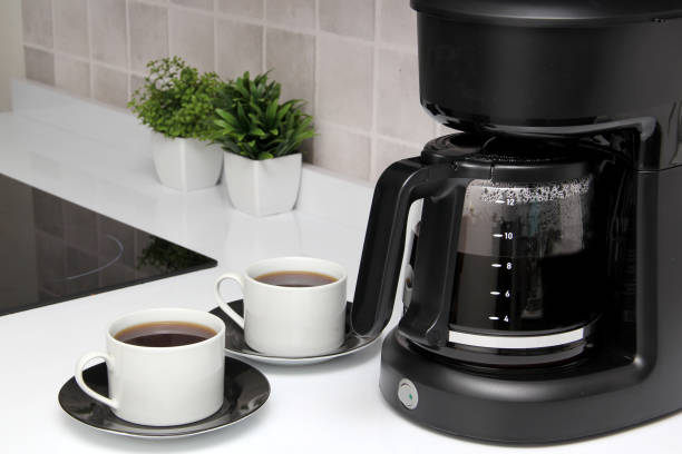 istock Freshly prepared coffee in a filter coffee machine served in white cups that is rich in antioxidants, fights Alzheimer's and Parkinson's, produces tachycardia and insomnia 1412579514