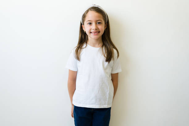 istock Cute little girl with a white basic mockup t-shirt 1412581433