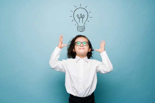 istock Talented kid thinking about a business idea 1412583414
