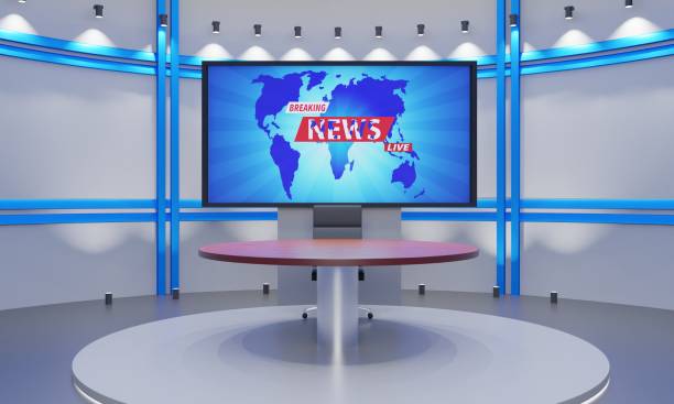 istock wooden table on stand with led screen background in a news studio room.3d rendering. 1412583421