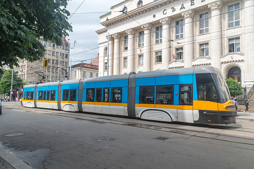Sofia, Bulgaria - June 6, 2022: Blue and yellow Pesa tram roduced by Polish company.