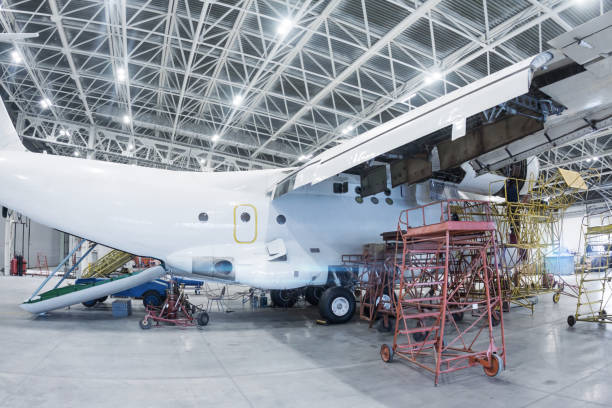 istock White transport airplane in the hangar 1412588118