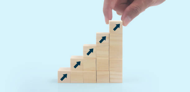 istock Business connecting piece of multi wood chart blocks steps in hand 1412588961