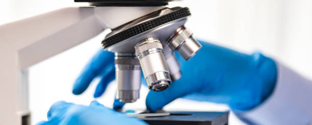 istock biotechnology scientist using scientific microscope for research in biology medicine laboratory, equipment for chemistry science or microbiology analysis in term of medical technology experiment 1412593432