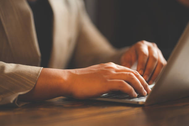 istock closeup business hand working to typing computer laptop keyboard in modern office or home workplace desk table, businessman using notebook for online technology communication job by using cyberspace 1412593453