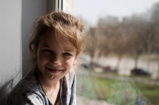 istock The child looks out the window 1412594403