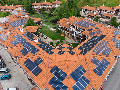 Luxury hotel With Solar Panels on the roof, aerial top down view