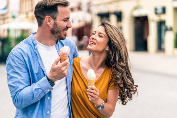 istock Happy couple eating ice cream 1412597312