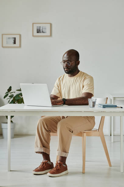 istock Businessman working on laptop at his workplace 1412598306