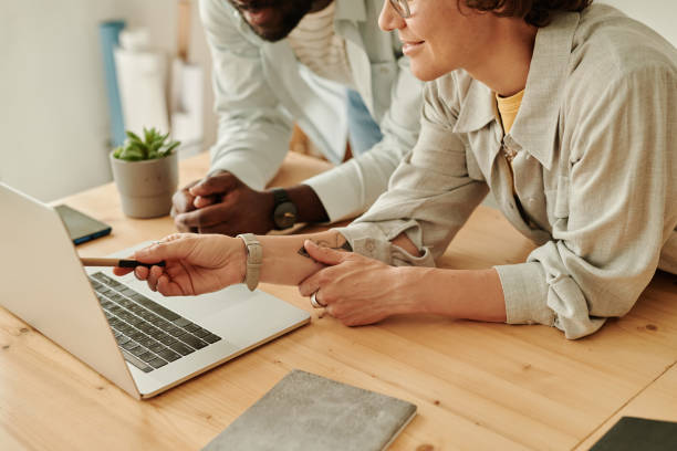 istock Business people working with online project on laptop 1412598392
