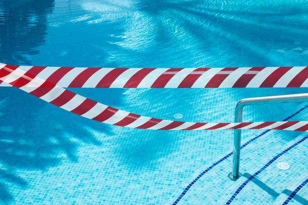 istock Red white Signal tape protects against entry into the pool. 1412600499