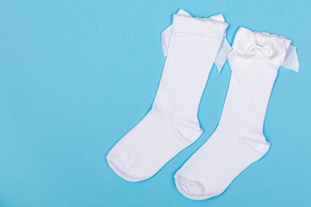 istock high white children's socks with big bows for festive clothes on a blue background 1412602548