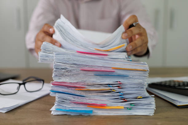 istock business administration and data documents on office desk, Stack of business overload paper. 1412605253