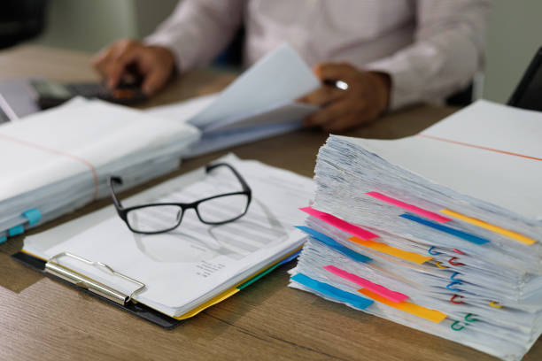 istock Business Documents concept  document achieves on folders papers at busy work desk office 1412605262