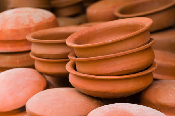 Traditional round clay pots for cooking on dispaly