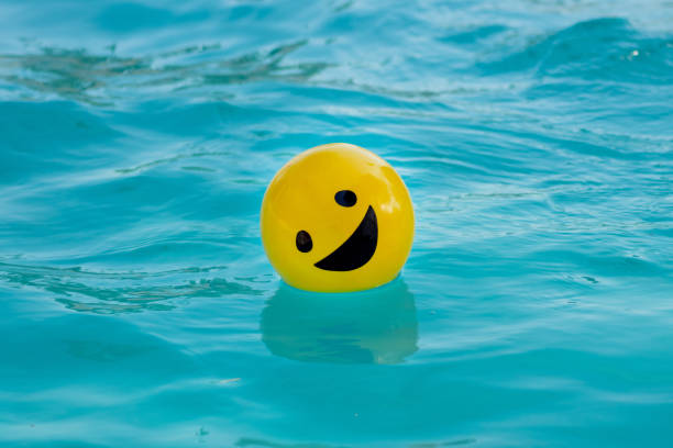 istock Yellow ball with a smiling face 1412606600