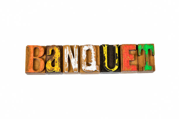 istock BANQUET. Colored wooden letters on a white background 1412609142