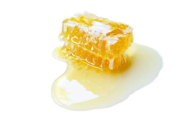 istock Honey comp with sticky honey isolated on white background. Selective focus. 1412610718