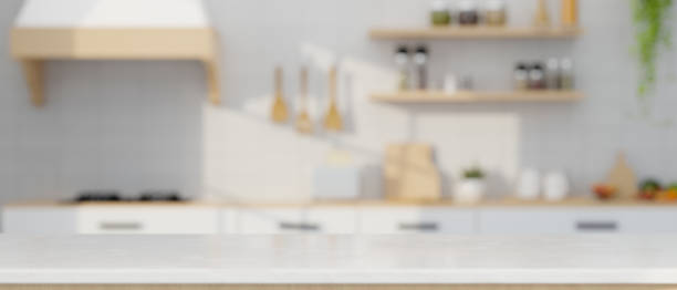 istock Empty mockup space over blurred modern minimal white kitchen cooking space in background. 1412613141
