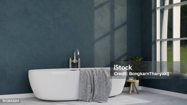Modern Luxury Bathroom Interior Design With Luxury Bathtub Bath Accessories And Blue Wall Stock Photo - Download Image Now