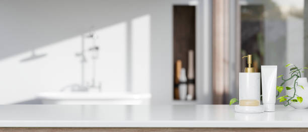 istock Bathroom tabletop with shampoo bottle, soap, and copy space over blurred elegance bathroom 1412613332