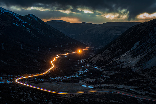 Vehicle light track on Sichuan Tibet highway in China.