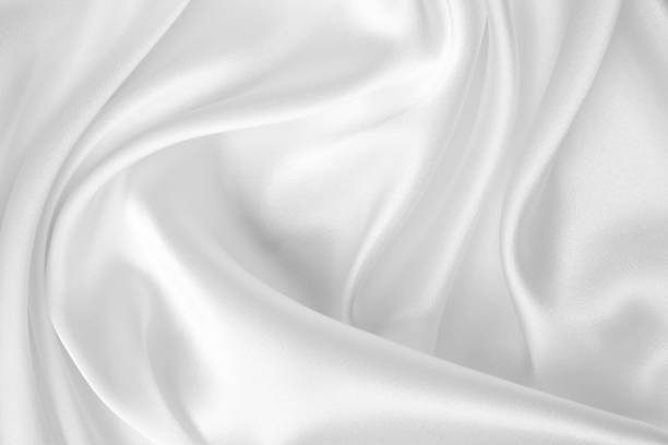 istock Smooth elegant white silk or satin luxury cloth texture can use as wedding background. Luxurious background design. 1412614988