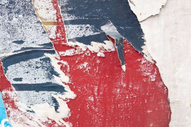 istock Torn street poster background. Abstract weathered paper collage 1412615442