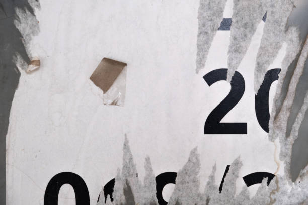 istock Ripped white paper on the wall and copy space background 1412615452