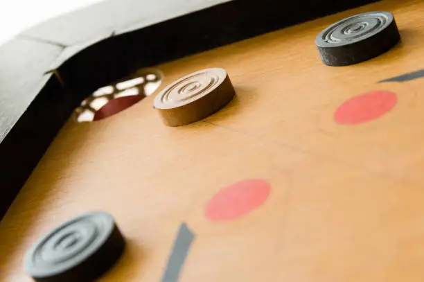 Photo of A game of carrom close to victory