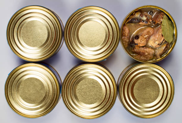 istock Canned fish on a gray background. View from above. 1412616684