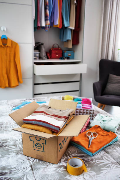istock T-shirts and delivery box on the bed 1412616789