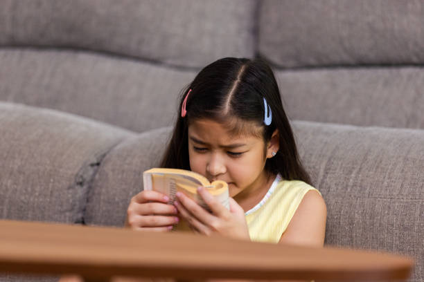 istock Child symptoms of myopia. 1412617148