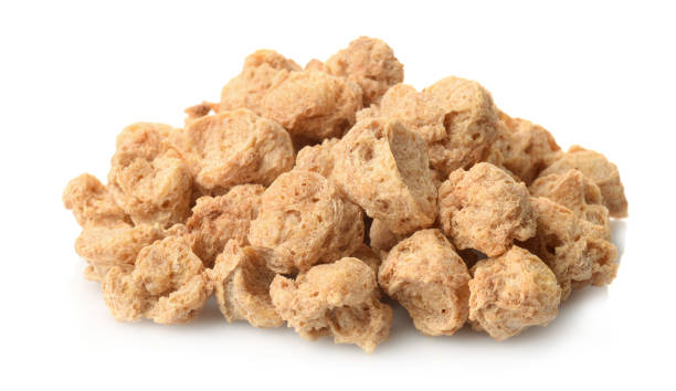 Pile of dry soya chunks Pile of dry soya chunks isolated on white tsp stock pictures, royalty-free photos & images