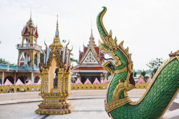 istock Statue Of Temple Against Building 1412619007